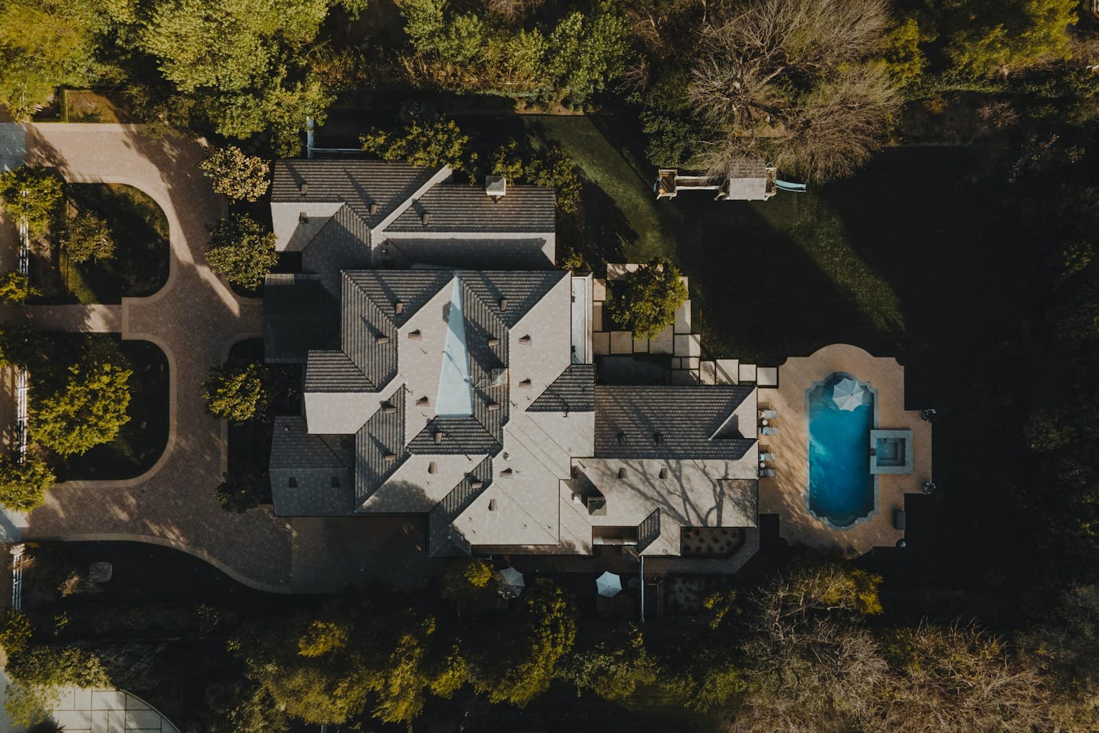 Aerial view of a forest property surrounded by trees